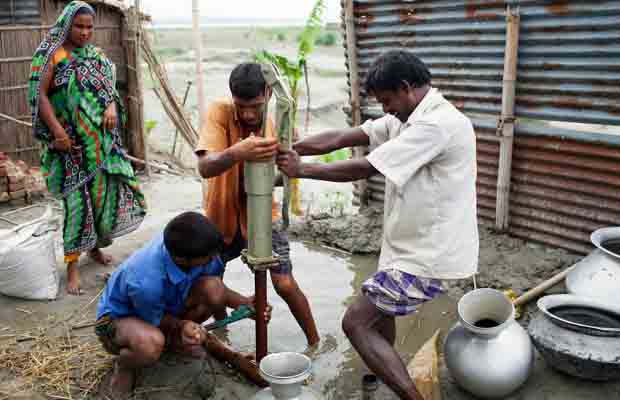 Participants installing tube-well for improved water source