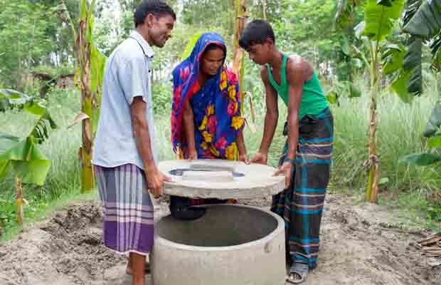 Participants setting up hygienic latrine on raised homestead